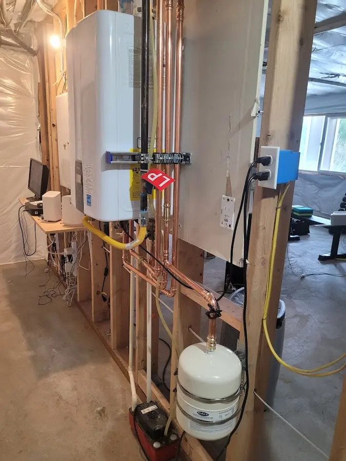 Licensed plumber repairing a kitchen sink in Wilton
